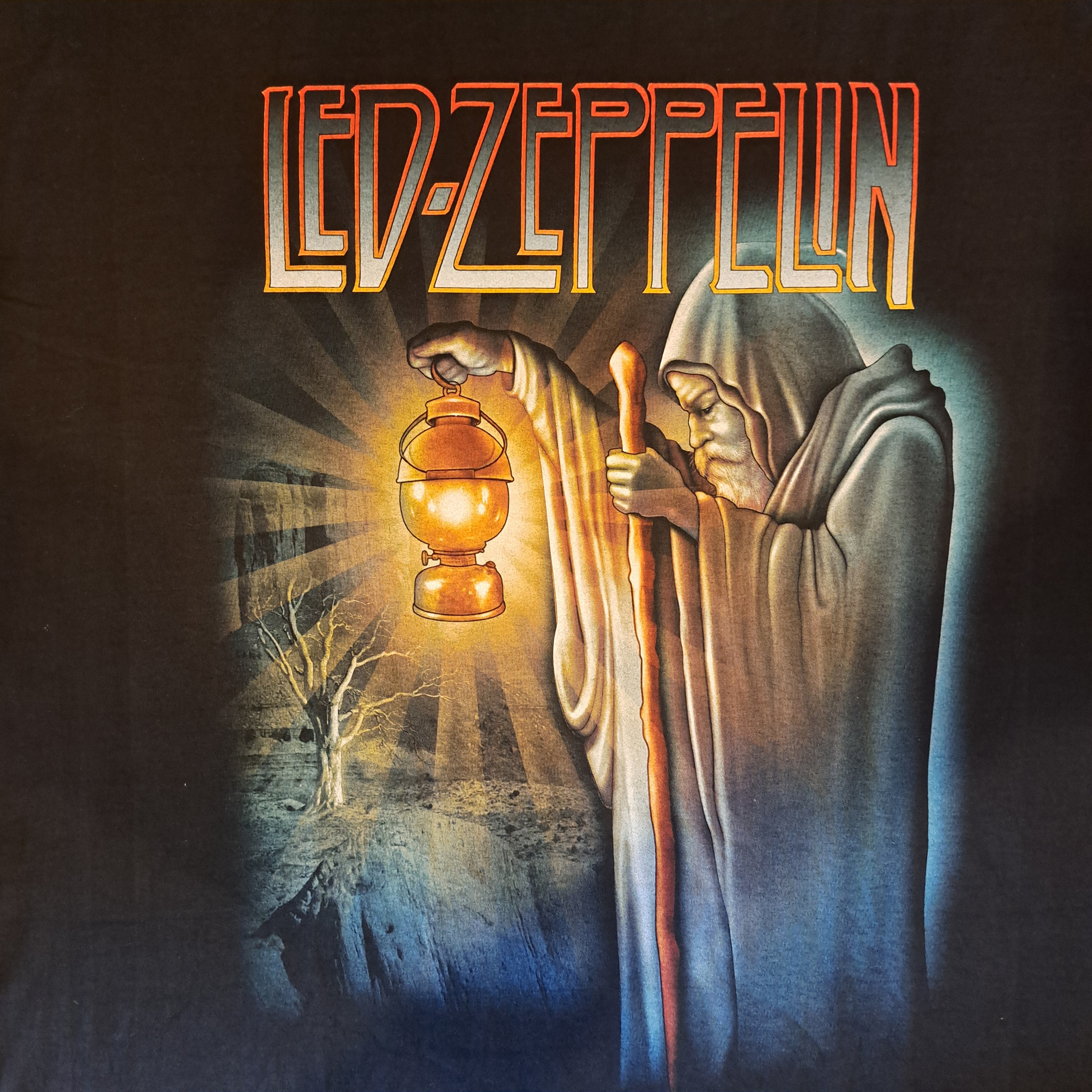 Album cover with 'Led Zeppelin' logo (The Hermit) and a statue holding a lamp.