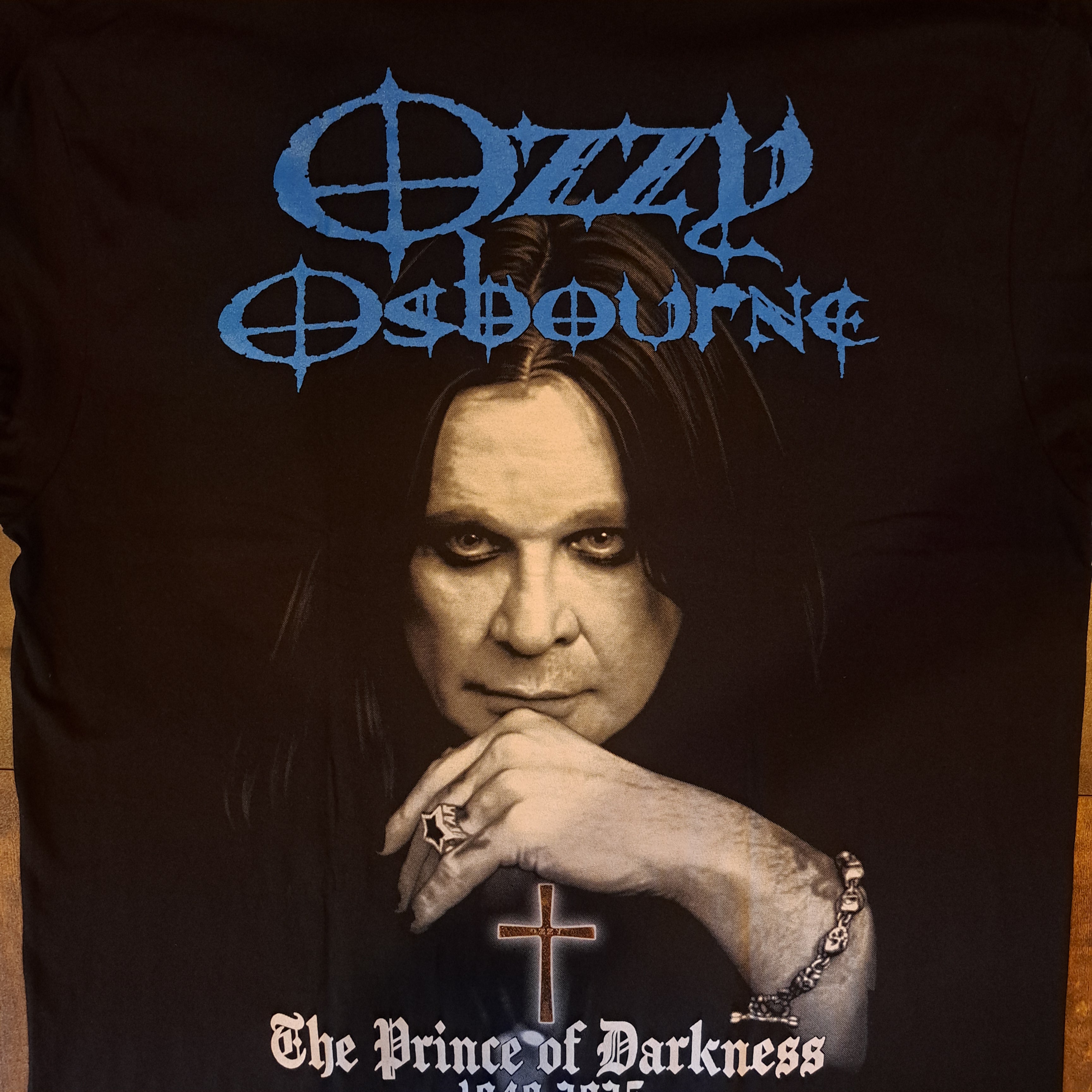 Black t-shirt with a graphic design of The Prince of Darkness. 
