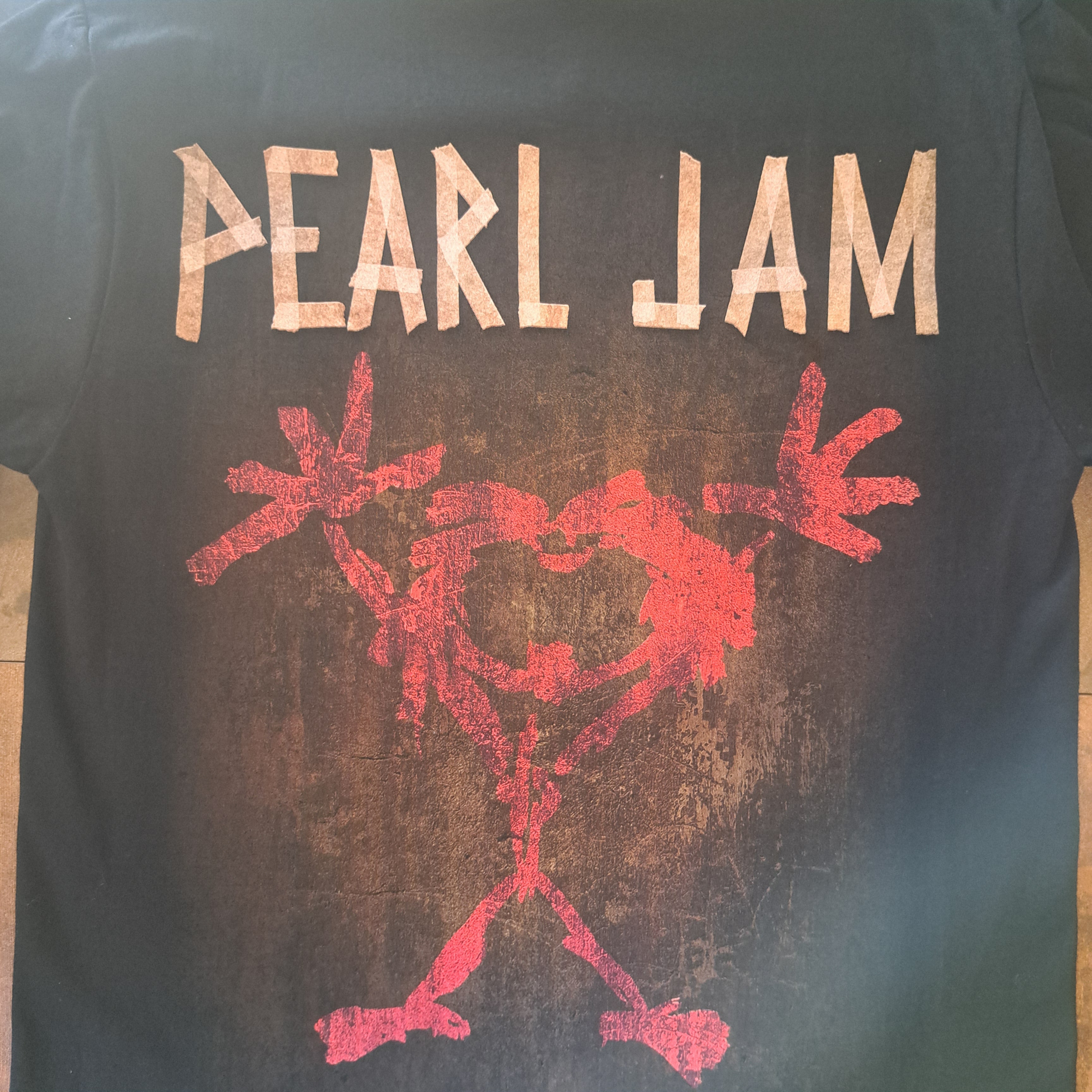 Black t-shirt with 'Pearl Jam' logo