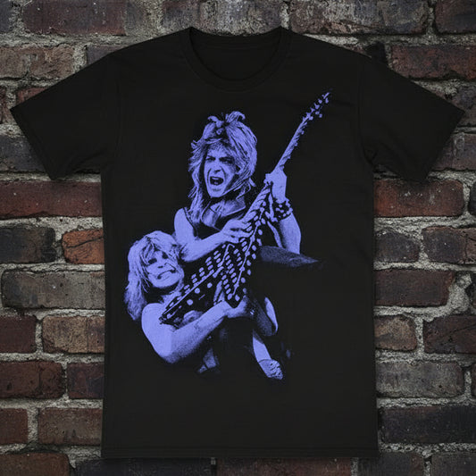 Black t-shirt with blue graphic design on a wooden surface. Randy Rhoads guitarist. Ozzy Osbourne. Front 