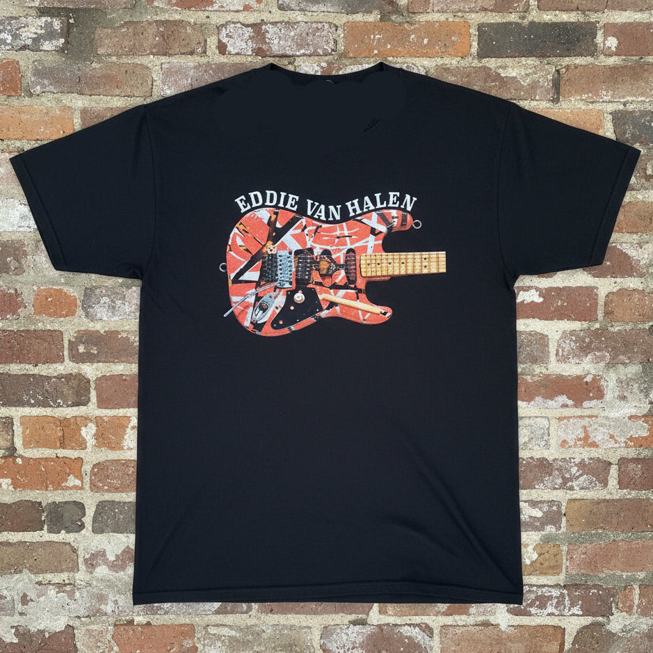 Black t-shirt with Eddie Van Halen guitar graphic on a brick wall background