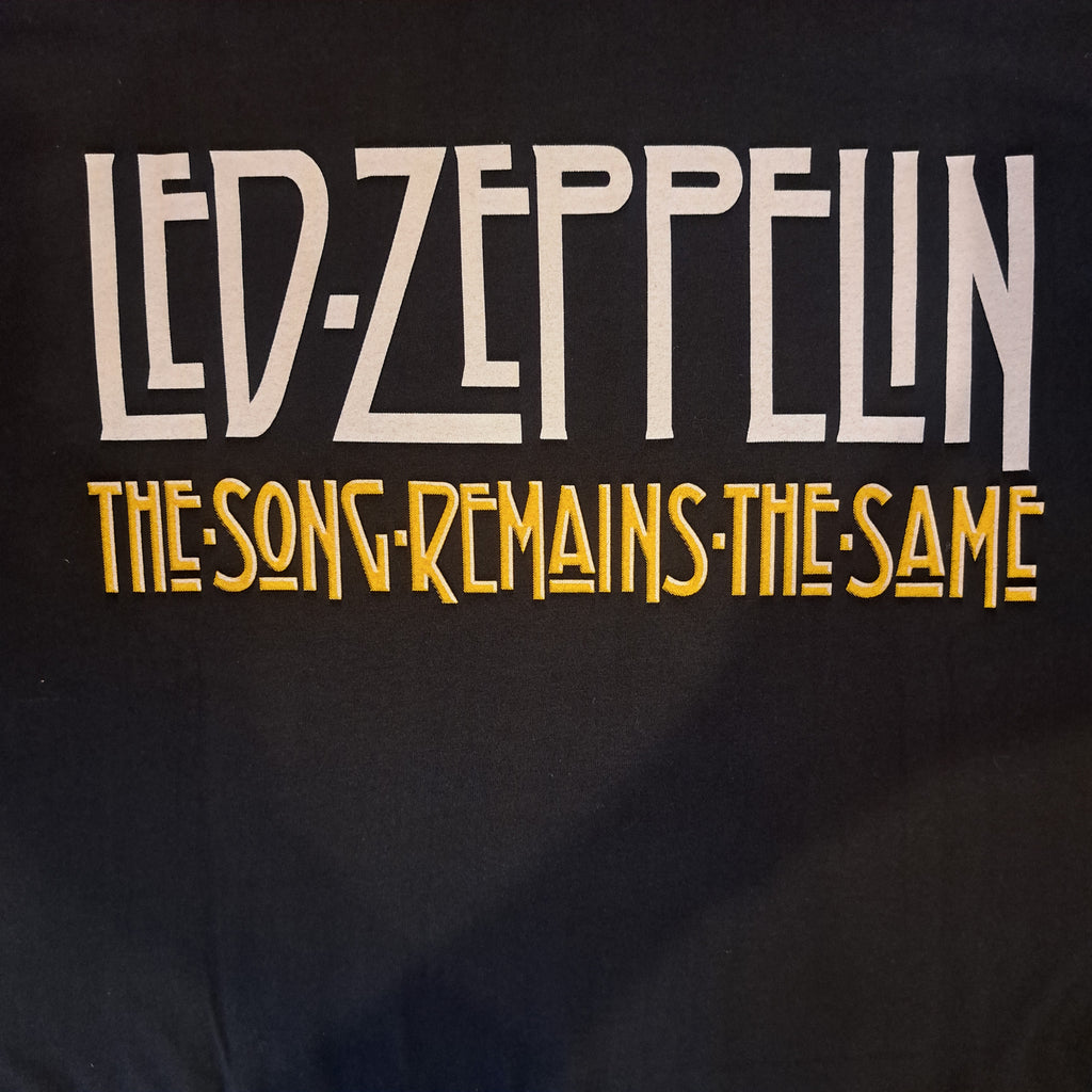 Led Zeppelin. "The song remains the same". FRONT